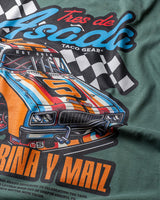 Taco Gear Tres de Asada Racing t-shirt featuring vintage racecar graphic, bold “Harina y Maíz” text, and checkered flag design on black and green tees.